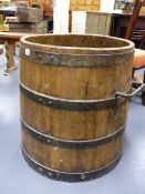 A LARGE IRON BOUND COOPERED LOG BARREL. H.61 x D.64cms (APPROX)