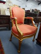 A CARVED GILTWOOD GEORGIAN ARMCHAIR OF NEOCLASSICAL DESIGN WITH BOWKNOT CREST , HUSK DECORATED FRAME