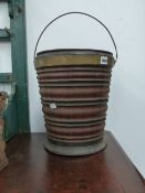 A DUTCH BRASS BOUND COOPERED BUCKET.