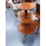 A 19th.C.MAHOGANY THREE TIER DUMB WAITER WITH DROP LEAVES ON SPLAYED SUPPORTS WITH BRASS CASTORS.