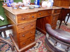 A VICTORIAN MAHOGANY INVERTED BREAKFRONT TWIN PEDESTAL DESK WITH MOULDED EDGE, THREE DRAWER TOP