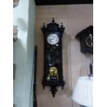 A VICTORIAN VIENNA WALL CLOCK WITH EBONISED CASE, UNSIGNED TWO PART ENAMEL DIAL COMPLETE WITH TWO