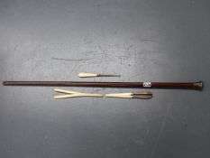 A SILVER MOUNTED WALKING CANE, GLOVE STRETCHERS,ETC.