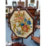 A VICTORIAN MAHOGANY POLE SCREEN WITH BERLINWORK PANEL.