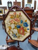 A VICTORIAN MAHOGANY POLE SCREEN WITH BERLINWORK PANEL.