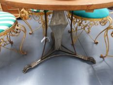 A PAIR OF CONTEMPORARY WROUGHT IRON AND OAK TOPPED GARDEN TABLES. D.90cms.
