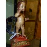 AN ANTIQUE CARVED POLYCHROMED STANDING FIGURE OF THE CHRIST CHILD, POSSIBLY SPANISH COLONIAL. H.