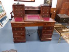 A VICTORIAN MAHOGANY TWIN PEDESTAL DICKENS DESK WITH RAISED DRAWERS OVER. W.137cms.