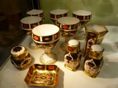 A SET OF SIX CROWN DERBY GOBLETS IN THE IMARI PATTERN TOGETHER WITH A PAIR OF SALT AND PEPPER