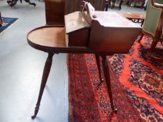 A MAHOGANY CUTLERY/PLATE STAND IN THE REGENCY GILLOWS STYLE, PIERCED HANDLE WITH TWO LIFT TOP