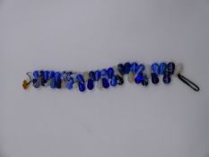 A STRING OF TRADE BEADS.