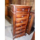 A FRENCH ROSEWOOD BEDSIDE CABINET WITH FOUR DRAWERS AND CHAMBER POT RECESS.