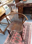 A 19th.C.COUNTRY BEECH AND ELM COMB BACK ARMCHAIR WITH SHAPED CREST RAIL STANDING ON CABRIOLE