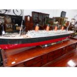 A SCRATCH BUILT MODEL OF R.M.S. TITANIC ON A STAND. L.136cms.