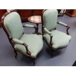 A PAIR OF FRENCH STYLE UPHOLSTERED ARMCHAIRS ON CABRIOLE LEGS.