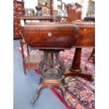 AN EARLY 19th.C.CARVED MAHOGANY TEAPOY WITH SHAPED TOP ABOVE EAGLE HEADED LYRE FORM BASE AND HAIRY