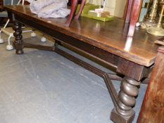 A SUSTANTIAL ANTIQUE OAK FLEMISH STYLE DINING/LIBRARY TABLE WITH BARLEY TWIST SUPPORTS AND SHAPED