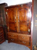 A LATE GEORGIAN COUNTRY OAK HANGING CUPBOARD WITH ARCHED AND INLAID PANEL DOORS OVER TWO FAUX AND