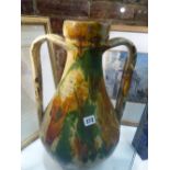 A LARGE CONTINENTAL SLIPWARE AMPHORA SHAPE TWIN HANDLED VASE. H.48cms.