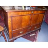 AN 18th.C.OAK AND MAHOGANY MULE CHEST WITH PANELLED FRONT OVER A SINGLE DRAWER BASE. W.118cms.