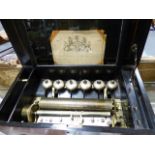 A 19th.C.LEVER WIND MUSICAL BOX PLAYING SIX AIRS OVER, 11" CYLINDER AND SIX BELLS IN ROSEWOOD AND