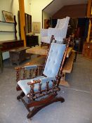 AN EARLY 20th.C.AMERICAN ROCKING CHAIR TOGETHER WITH AN EDWARDIAN CHILD'S WING ARMCHAIR. (2)