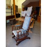 AN EARLY 20th.C.AMERICAN ROCKING CHAIR TOGETHER WITH AN EDWARDIAN CHILD'S WING ARMCHAIR. (2)