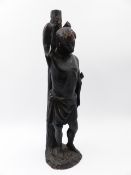 AN ANTIQUE CARVED STATUE OF A BOUND STANDING FIGURE. H.32cms.