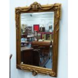 A CLASSICAL STYLE GILT FRAMED MIRROR. W.79 x H.120cms.