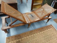 A VICTORIAN CAMPAIGN TYPE FOLDING DAYBED WITH CANE PANELS.