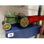 AN ENGLISH TINPLATE TOY TRACTOR AND TRAILER MARKED MADE IN GT.BRITAIN.
