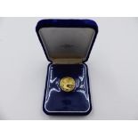 A BRITISH VIRGIN ISLANDS 1975 100 DOLLAR FINE GOLD COIN, UNCIRCULATED.