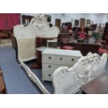 A FRENCH CARVED AND PAINTED ROCOCO STYLE DOUBLE BEDSTEAD, ELABORATE PIERCED HEAD AND FOOTBOARDS WITH