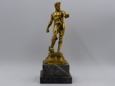 A SILVER GILT FIGURE OF NEPTUNE AFTER THE ANTIQUE STAMPED 800 ON A STEPPED MARBLE BASE. H. (