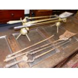 A PAIR OF CHRISTOPHER DRESSER DESIGN BRASS ANDIRONS, A SIMILAR SET OF BRASS FIRE TOOLS AND A SET