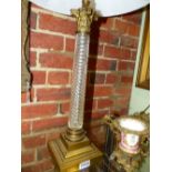 A PAIR OF GLASS BRONZE MOUNTED TABLE LAMPS OF COLUMN FORM, SWIRL GLASS WITH STEPPED BASES AND
