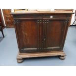 AN 18th.C.CONTINENTAL OAK LOW CABINET WITH PANEL DOORS ENCLOSING MULTI DRAWERS FITTED INTERIOR, SIDE