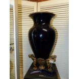 A BRONZE FIGURAL MOUNTED BLUE POTTERY URN IN THE ART DECO MANNER. H.50cms.