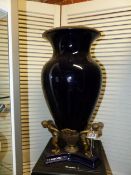 A BRONZE FIGURAL MOUNTED BLUE POTTERY URN IN THE ART DECO MANNER. H.50cms.