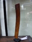 AN ANTIQUE CHINESE IVORY HU TABLET ON CONFORMING MUSEUM STAND. HEIGHT 38cms.