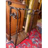 AN ARTS AND CRAFTS WROUGHT IRON AND COPPER STICKSTAND.