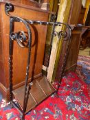 AN ARTS AND CRAFTS WROUGHT IRON AND COPPER STICKSTAND.