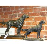 THREE ANIMALIER TYPE FIGURES OF DOGS, TWO SETTERS AND A TERRIER AND AN IRON FORM DOG NUTCRACKER.