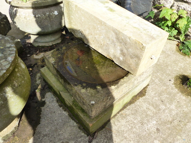 A CARVED STONE PEDESTAL BIRD BATH.