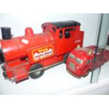 A TRI-ANG PUFF-PUFF TRAIN AND A WEST GERMAN TINPLATE FIRE ENGINE.