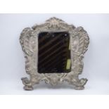 A WHITE METAL STAMPED 900 REPOUSSE ROCOCO STYLE MIRROR MOUNTED ON WOOD. APPROXIMATE MEASUREMENTS