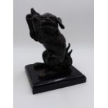 A JAPANESE BRONZE FIGURE OF A SEATED FOO LION. H.16cms.