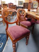 A SET OF SEVEN CARVED MAHOGANY VICTORIAN DINING CHAIRS WITH RING TURNED TAPERED LEGS.