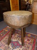 AN 18th.19th.C.RUSTIC CHOPPING BLOCK ON FOUR TAPERED SQUARE LEGS, D.53cms.