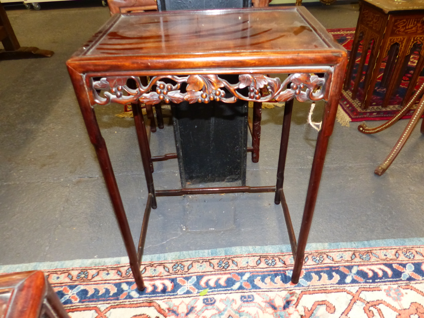 A NEST OF FOUR CHINESE CARVED HARDWOOD TABLES WITH PIERCED FOLIATE APRONS. - Image 18 of 19